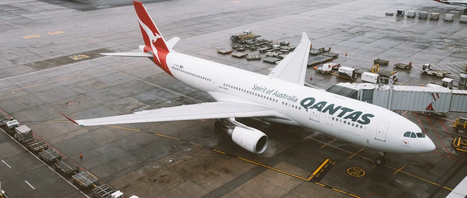 Wide-body freighter aircraft being loaded on the apron